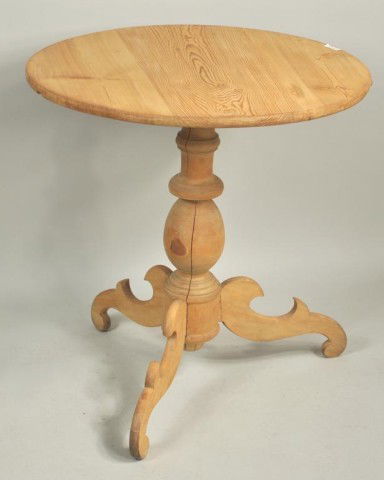Primitive Pine Round Tripod Table: Round pine tip top table with turned standard and cutout legs. European, 19th century. 28" high, 27" diameter.
