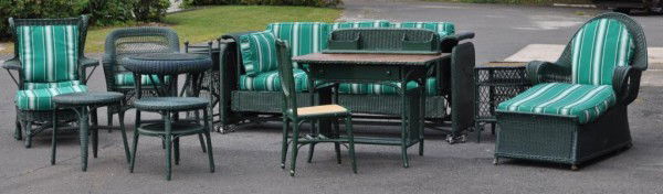 Assembled Suite of Painted Wicker Furniture: Assembled suite of green painted wicker furniture, comprising: chaise w/ottoman, two armchairs, two small round low tables, one rectangular planter, one desk w/separate superstructure, one side chair,