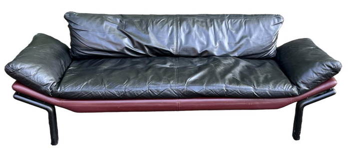 Komfort Danish Modern Leather Couch: black with red trim base. 26 1/2" high, 81" wide, 30 1/2" deep; seat height: 15 1/2". Scuffs, use wear. Estate of Adolph S. Cavallo.