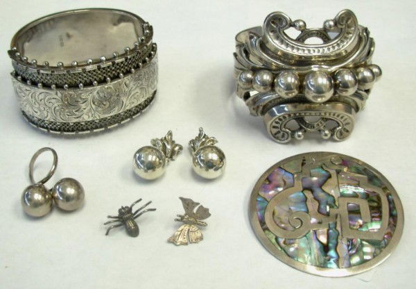 Two Bracelets, Pair Earrings, Ring and Three Pins: English late 19th century sterling bracelet, 47.8 grams; and American silver bracelet signed CINI (1922-1979) 2.48 troy oz; a silver and abalone shell pin; a pair of silver cuff links; a small insect