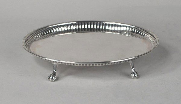 George III Silver Teapot Stand, London 1786: George III silver teapot stand, Hester Bateman, London 1786, oval form with gadrooned and reeded rim, on four claw and ball feet. 4 troy oz., 6 7/8" long. Repair in rim and tray at two feet, possible