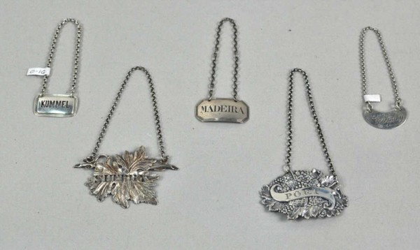 Group of Five English Silver Decanter Labels: Group of five English silver decanter labels, comprising a Sherry label, Owen & Boon, Birmingham, 1856, of pierced leaf form; a Port label, Wardell & Kempson, Birmingham, 1810, pressed with grape bunc