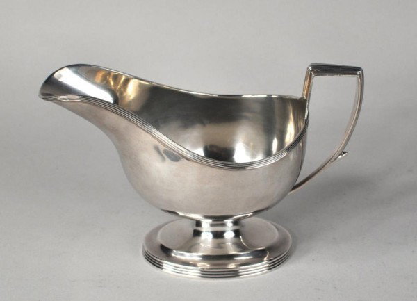 George III Silver Sauceboat, London 1807: George III silver sauceboat, William Bateman, London, 1807, of boat form on pedestal foot, with reeded rims, harp-shaped handle. 8.7 troy oz., 4 3/4" height to handle.