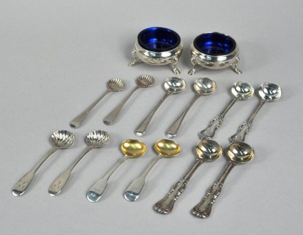 Pair George III Silver Salts, Six Pair Salt Spoons: Pair of George III silver salts and six pairs of English silver salt spoons, the salts by Nathaniel Appleton & Anne Smith, London, 1780, each circular on three hoof feet, with blue liners. The salt sp