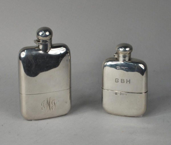 Two English Silver Flasks, 1896, 1911: Two English silver flasks, the first Victorian by S. Mordan & Co., London, 1896, plain with detachable drinking cup, with gilt interior, monogrammed; the other by Mappin & Webb, Birmingham, 1911, plai