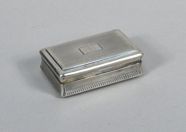 George III Silver Table Snuff Box: George III silver table snuff box, Daniel Hockley and Thomas Bosworth, London, 1815, rectangular with engine-turned sides, empty cartouche, gilt interior. 3.8 troy oz. 3 1/4" long.