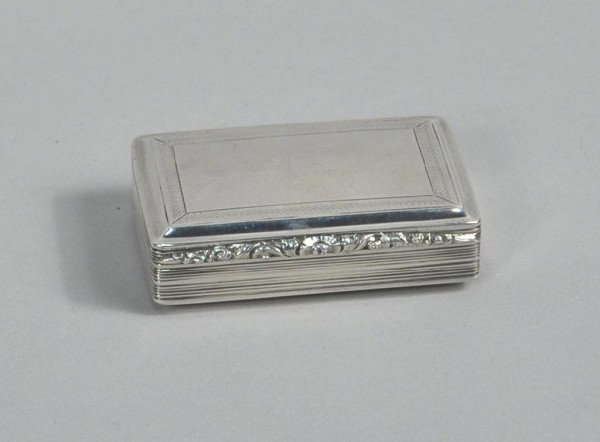 William IV Silver Table Snuff Box: William IV silver table snuff box, Nathaniel Mills, Birmingham, 1832, rectangular, the lid with engine-turned border, the sides and base with reeded bands, gilt interior. 3/4 troy oz., 3 1/4" long.