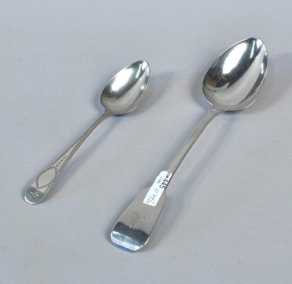 Two Irish Silver Spoons, 1800 & 1831: Two Irish silver spoons, the first a stuffing spoon, L. Nowlan, Dublin, 1831, the fiddle handle engraved with crest, the second by Michael Keating & Co., Dublin, 1800, with bright-cut handle, 6 troy o