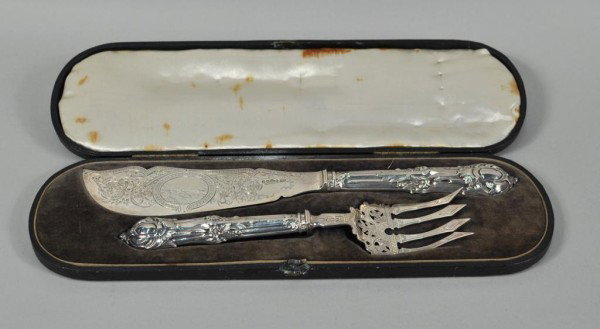 Pair of Victorian Silver Fish Servers: Pair of Victorian silver fish servers, Henry Atkins, Sheffield, 1861, the blade of the knife engraved with a waterfall vignette within an oval cartouche and scrolling foliage and diaperwork border, th