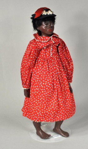 African American Female Doll in Red Dress: Vintage African American hand painted, part- composition/part stuff cotton jointed female doll in red dress marked "1958 A? Mead" on the back. 17 1/2" high.