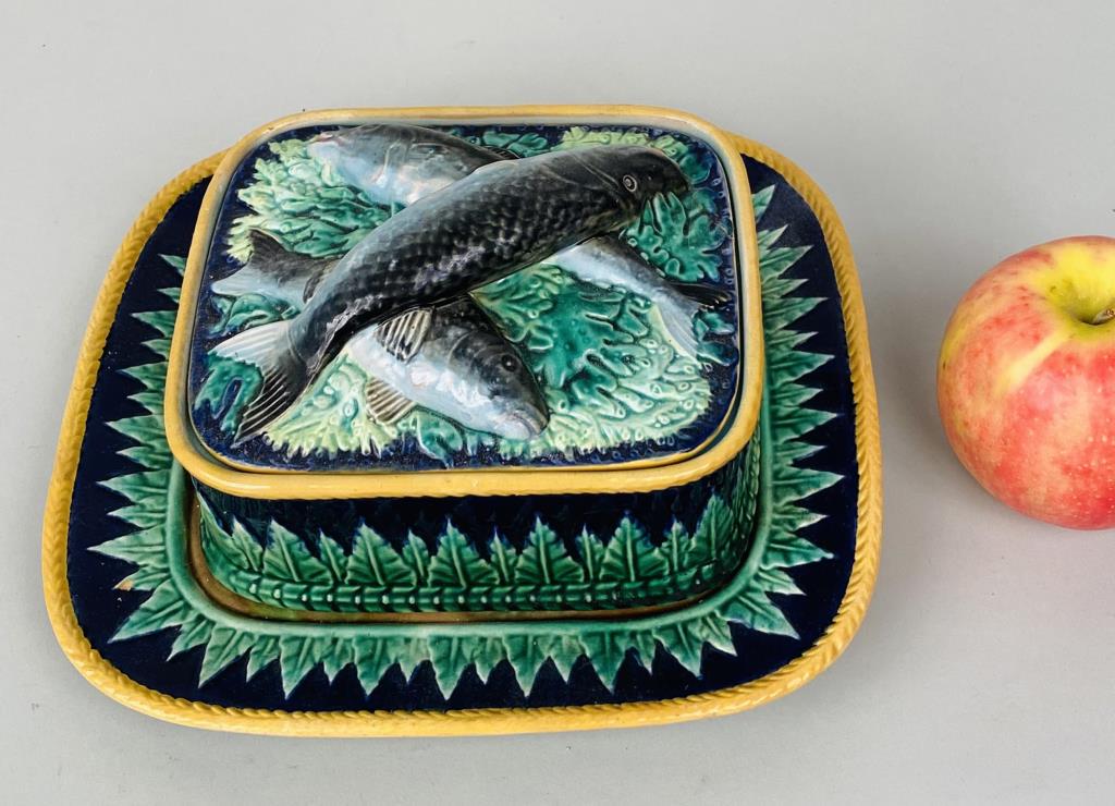 George Jones, Majolica Sardines Box/Underplate: three pieces total. Under plate: 8 3/4" high, 7 3/4" wide; box: 3 3/4" high, 5 7/8" wide, 5" deep. Repairs to lid, glaze crazing.