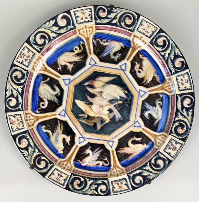 Renaissance Style Majolica Lustre Charger: with gryphon and foliate motif, 20th century. 18 1/2" diameter. Small edge chip, soiling verso.