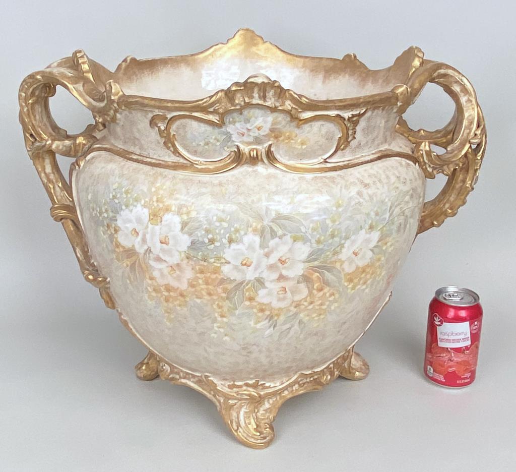 Royal Bonn Porcelain Jardiniere: 17" high, 22" wide, 17" deep. Soiling to interior, crazing chip on one handle.