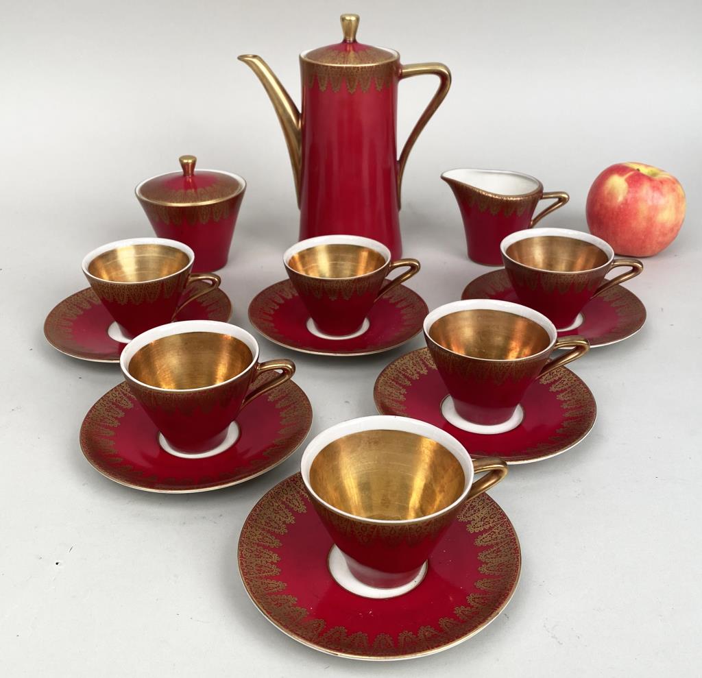 Royal Porzellan Coffee Service: comprising coffee pot, creamer, sugar and six cups and saucers. Coffee pot: 7 1/4" high, 6 1/4" wide, 3 3/8" deep; saucer: 4 7/8" diameter. Lid possibly repaired, one saucer with black mark, one with 