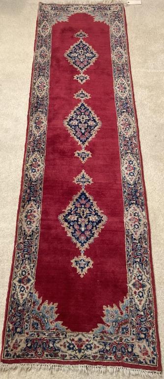 Oriental Runner: with triple medallion on a deep red field. 2' 5" wide, 9' 1" long. All rugs sold as is.