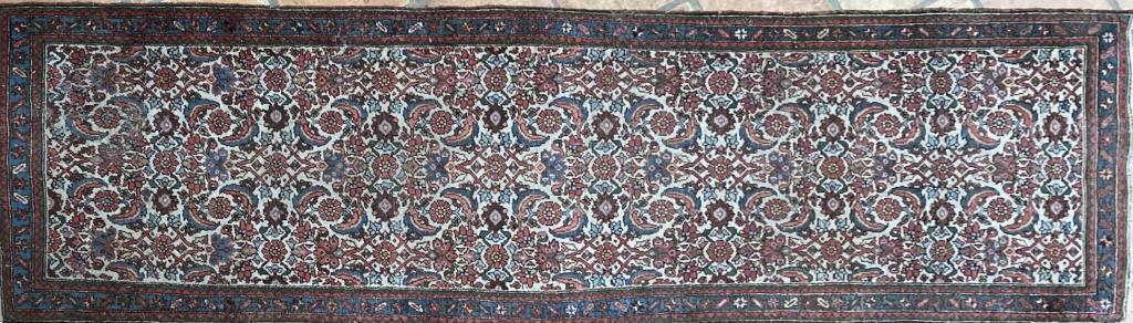 Oriental Runner: with overall design. 9' 3" long, 2' 9" wide. Slight wear, a few frays,areas of moth damage to one end. All rugs sold as is.