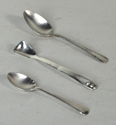 Georg Jensen Sterling Small Spoon, Plus Two: Sterling silver spoon marked "George Jensen Inc - Sterling", together with two other small sterling silver spoons. Largest: 6" long; smallest: 4 3/4" long. 2.12 troy oz.