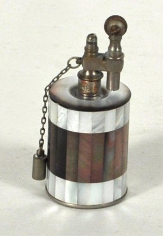 Mother of Pearl Lighter, Tiffany - France: Mother of pearl lighter, stamped on underside "Tiffany & Co - France" with small stamped medallion that reads "Minister Finance." 4" high, 1 1/2" diameter.