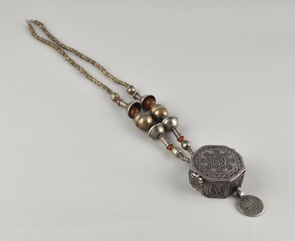 Middle Eastern Partial Silver Necklace: Middle Eastern metal and part silver necklace, comprised of a neckpiece with lidded box pendent with an attached coin fob. 17" long.
