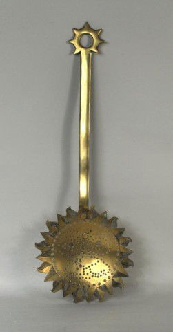 Antique Brass Skimmer: Interesting and perhaps unique antique brass skimmer with sun form perforated bowl and modified sun handle. European, 19th century. 21 3/4" long.