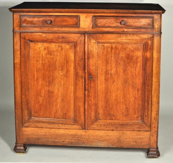 French Provincial Directoire Walnut Cabinet: Period French provincial carved walnut cabinet with two drawers and two doors, set on bracket form feet. 48" high, 50 1/4" wide, 21 1/4" deep