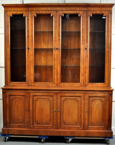 Regency Style Mahogany Breakfront: Regency style mahogany breakfront, with cornice top section with glass doors, set on a base with four paneled doors and set on plinth base. 82" high, 70 1/2" wide, 19" deep