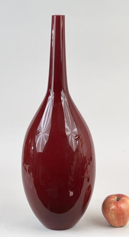 Sang du Boeuf Color Art Glass Vase: cased glass tall vase in the manner of Holmegaard; unsigned. 21 1/4" high, 7" diameter. Light flaking to top inner edge.
