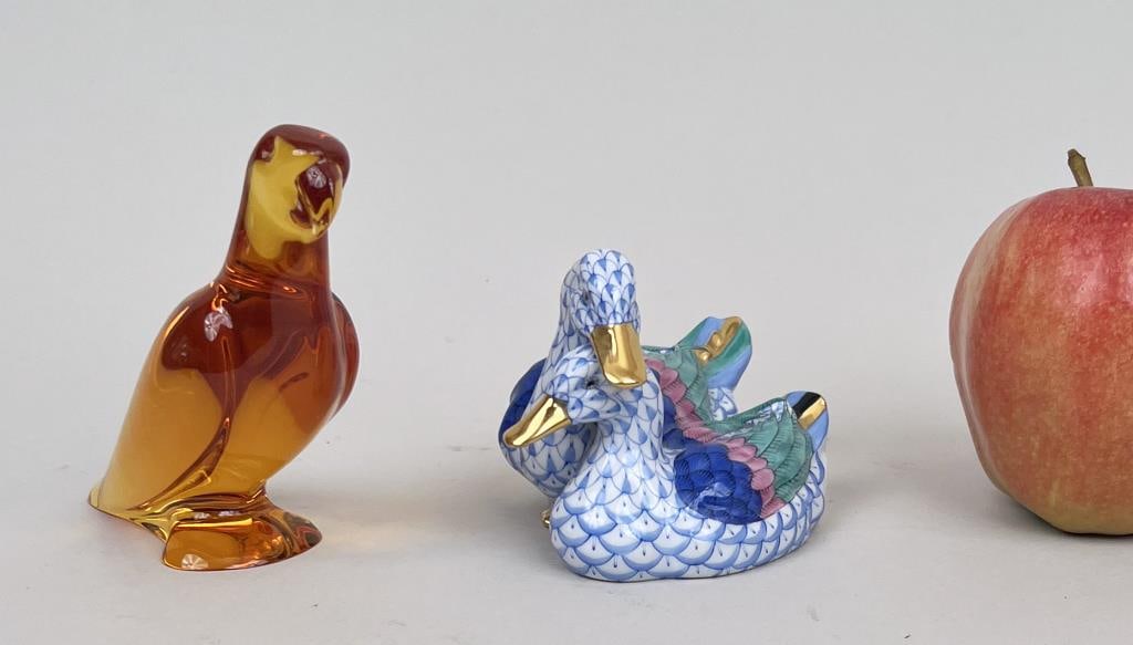 Baccarat & Herend Bird Form Items: comprising an amber color Baccarat parrot and an Herend duck figurine. Baccarat bird: 4" high, 3" deep, 1 1/2" wide. Parrot with minute flick at tail, light wear to bottom of base.