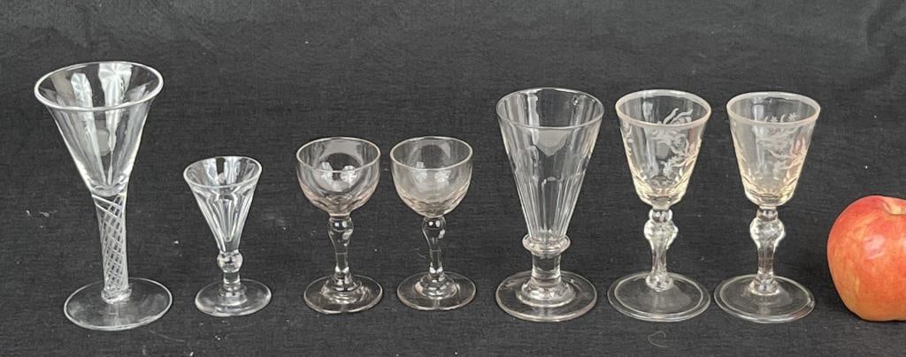 Group Seven British Flint Glass Wares: eighteenth century, comprising: pair etched flint glasses, an air twist glass, pair of cordials and two additional claret or port glasses. Largest: 6 1/2" high, 3 1/4" diameter. Estate found condition