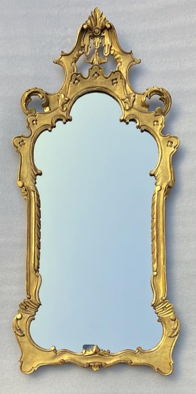 Italian Carved Giltwood Mirror: rococo design, 19th century or earlier. 38" high, 18" wide. Some wear and gesso/gilding losses.