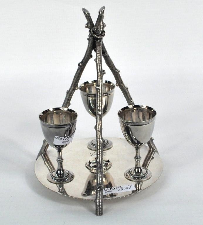 English Silver Egg Cup Holder, Thomas Prime, 1872: Unusual English silver egg cup holder, with three branch form supports, set on locating pins on a round platform stand, monogrammed. Thomas Prime and Son, Birmingham 1872. Approximately 22.595 troy oz