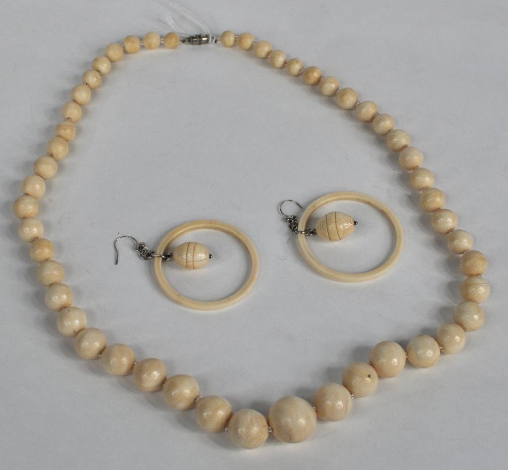 Ivory Beaded Necklace & Ivory Drop Earrings: Ivory beaded necklace with graduated size ivory balls, with silver clasp, together with a pair of interesting ivory earrings of ring and drop design. Necklace 24" long, earrings 1 5/8" diameter.