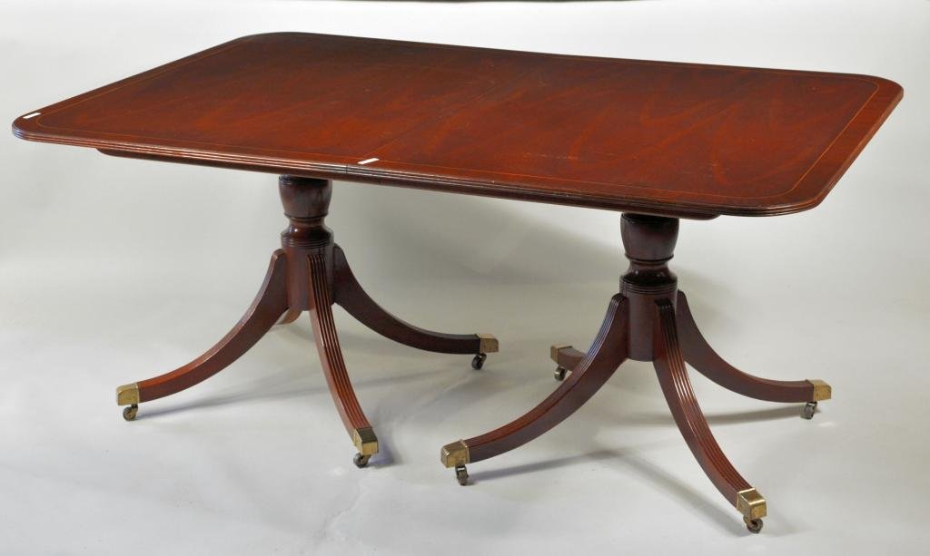 Sheraton Style Inlaid Two Pedestal Dining Table: Sheraton style double pedestal base dining table with rectangular top with inlaid banding, together with two leaves. 29 3/4" high, no leaves: 67 1/2" wide, leaves 107 1/2" wide, 45 3/4" deep.