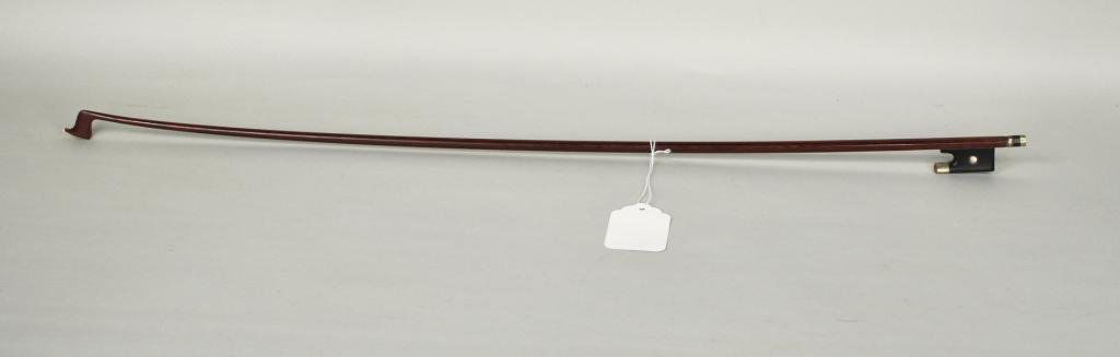 French Violin Bow Stamped "Vuillaume A Paris": A silver-mounted violin bow stamped VUILLAUME À PARIS, the round stick mounted with an ebony frog and silver and ebony adjuster with pearl eye. Weight 55.98 grams. 28 3/4" long.