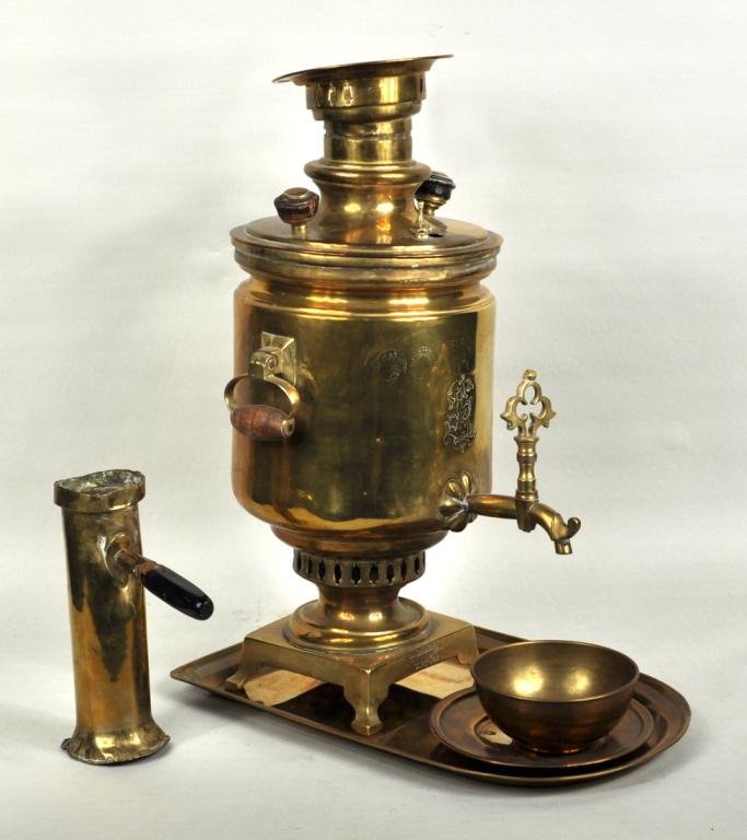 Vintage Brass Samovar: Brass samovar with funnel, bowl, plate and undertray. Russian, late 19th C. Some denting to body and funnel. 18 1/2" high, 9" wide, 15" deep.