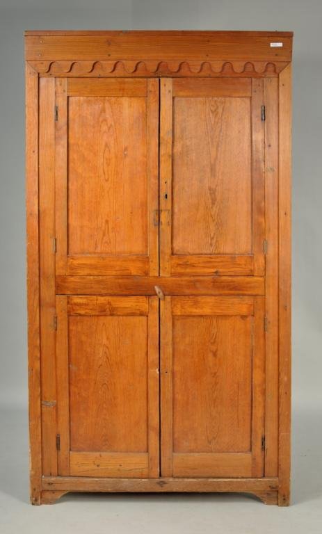 Rare Carolina Yellow Pine Corner Cupboard: Rare Southern American yellow pine architectural corner cupboard, with scalloped cornice decoration and four inset paneled doors. According to family tradition, this cupboard was removed from a South 