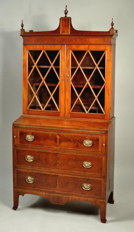Hepplewhite Inlaid Mahogany Secretary Desk: Hepplewhite inlaid mahogany two part secretary desk, with arcaded cornice above a bookcase top with mullioned glass doors, set on a base with fold down writing board and graduated drawers set on Frenc