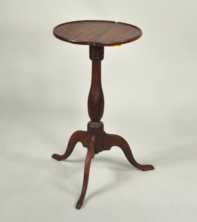 American Queen Anne Cherry Candlestand, 18th C.: American Queen Anne cherrywood round top candlestand, with turned column and arched cabriole legs. 26 1/2" high, 18" wide, 20 1/2" deep. Splits and additions in top, overall roughness.