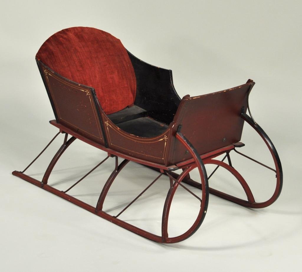 Victorian Painted Child's Push Sleigh: Victorian child's push sleigh, red painted with string detail, bentwood runners with wrought iron reinforcements and braces. Appears to retain original decoration and upholstery, lacking push handle a
