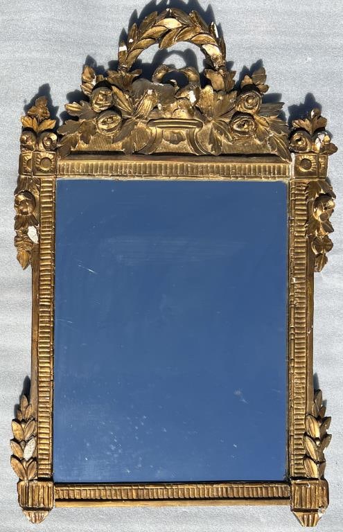 French Louis XVI Gilded Mirror: with foliate form accent and central nesting birds, laurel wreath and roses. 46" high, 29" wide. Scattered losses, silvering wear.