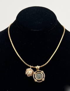 Chopard 18K Gold Necklace: with Roman coin set in 18k gold and 14k lion head pendant featuring diamond eyes. Chain: 16" long. Coin pendant: 1 5/8" high, 1" wide. Gross weight: 25.8 DWT. *No credit card payments will be accepted