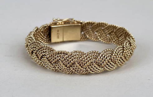 Correa Twisted Rope Braided 14K Gold Bracelet: AGA Correa & Son marked "AGA 14K". Approximately 6 1/4" long, 5/8" wide. Weight: 29.8 DWT. *No credit card payments will be accepted for silver, gold, or jewelry from buyers that have not purchased fr