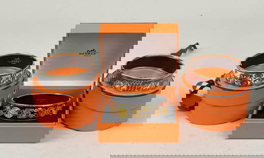 Three Hermes Enamel Bangles: comprising Grand Apparat, horse and carriage and Imprimes (equestrian horses). All with boxes. 2 3/4" diameter. 7/8" wide; varying slightly in size (approximately 1/16"). Light use wear, Imprimes with