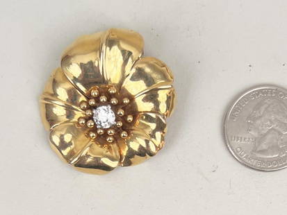 Cartier 18K Gold & Diamond Floral Brooch: center diamond 75 pts, grade VSI color EF, signed Cartier, Paris, mounted as fur clip. 1 1/2" diameter. Gross weight: 15.6 DWT. *No credit card payments will be accepted for silver, gold, or jewelry f