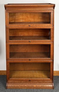 Four Section Globe-Wernicke Barrister Bookcase: of typical form with projecting stepped top and base. 59 1/2" high, 34" wide, 14" deep. Scratches, wear.