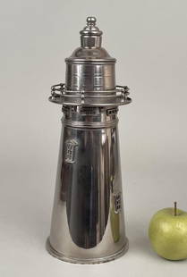 Modern Nickel Lighthouse Form Cocktail Shaker: chrome/nickel plated cocktail shaker in the form of a lighthouse, modeled after the famous Boston lighthouse circa 1720, the first lighthouse built off the North American coast; stamped on the bottom