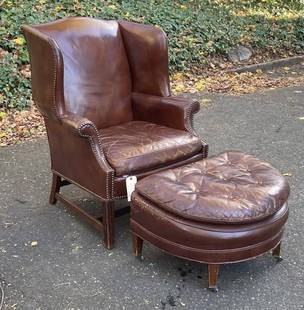 Chippendale Style Leather Wing Chair & Ottoman: with nailhead trim, tufted cushion. Chair: 41" high, 33" wide, 28" deep. Wear to leather as shown, some distress and pocking on chair leather, scuffing and abrasions to ottoman leather, wear to caster