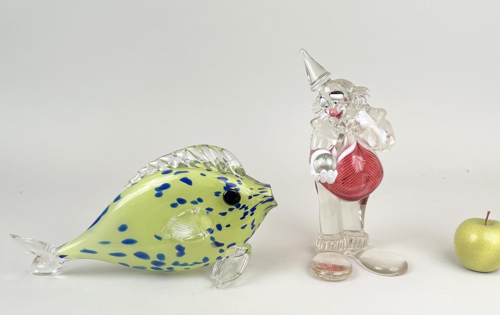 Two MCM Art Glass Sculptures: comprising a signed fish and an Abelman clown sculpture. Fish: 7 1/2" high, 14" wide, 4 3/4" deep. Clown with repaired arm/and shoulder.