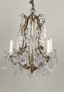 Small Gilt Brass Framed Crystal Chandelier: in the Regency style, with four candle form lights. 18" high, 17" diameter. A few missing crystals.