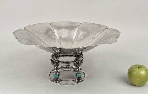 Erik Magnussen, Gorham Sterling Footed Bowl: with lobed and channeled basin above a circular staged base incorporating ball and trumpet motifs encasing turquoise spheres. 7 1/4" high, 16 1/8" diameter. Gross weight: 74.945 OZT. Marked on bottom